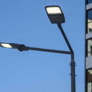 A modern street LED lighting pole. Urban electro-energy technologies. Savings on street urban road lighting.